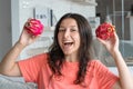 Girl and dragon fruit. Joyful girl enjoying tropical fruits Royalty Free Stock Photo