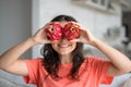 Girl and dragon fruit. Joyful girl enjoying tropical fruits Royalty Free Stock Photo