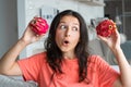 Girl and dragon fruit. Joyful girl enjoying tropical fruits Royalty Free Stock Photo