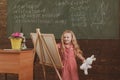 Girl draw picture in art school. Little artist paint on studio easel, art education, vintage filter