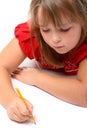 Girl drawin on paper with pencil isolated on white