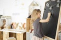 Girl drawing on blackboard