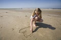 Girl drawing a heart Royalty Free Stock Photo