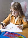 Girl drawing at home