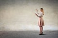 Girl drawing on a neutral background