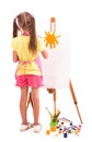 girl draws a house and the sun. artist kid girl painting over white background Royalty Free Stock Photo