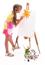 girl draws a house and the sun. artist kid girl painting over white background Royalty Free Stock Photo