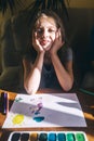 Girl draws with paints. The concept of creative development and happy childhood. Drawing lessons online and with a teacher. Art Royalty Free Stock Photo