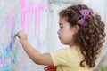 Girl draws on the wall