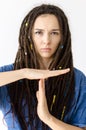 Girl with dreadlocks shows time out sign with hands Royalty Free Stock Photo