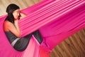 Girl dreaming and meditation in hammock hanging in relaxed position Royalty Free Stock Photo