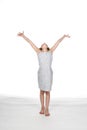 Girl in dress with arms up Royalty Free Stock Photo