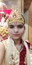 A girl dress as Hindu god krishna.