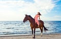 Girl in dress with horse on seacoast Royalty Free Stock Photo