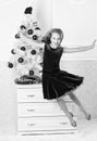 Girl in dress jumping. It is christmas. Day we have waited for all year finally here. Girl excited about christmas jump