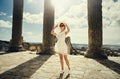 Girl in a dress on ruins. Capitol. Travel, vacation. Tunisia, Dougga.