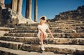 Girl in a dress on ruins. Capitol. Travel, vacation. Tunisia, Dougga.