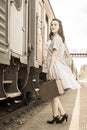 A girl enters the passenger train railcar. Royalty Free Stock Photo