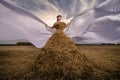 Girl in a dress from wheat , straw fashion