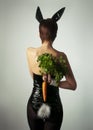 A girl dressed as a rabbit holding Royalty Free Stock Photo