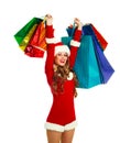 Girl dressed as Santa with many shopping bags