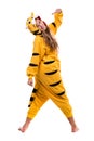 Girl dressed as a tiger with thumbs up, isolated on white in full length.