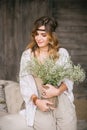 Girl dressed with large bouquets of white flowers Royalty Free Stock Photo