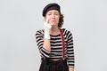 Girl dressed like mime wiping tears from eyes with fingers Royalty Free Stock Photo