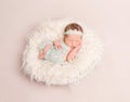 Girl dressed in lovely pastel suit sleeping Royalty Free Stock Photo