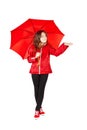 Girl dressed in raincoat holding umbrella Royalty Free Stock Photo