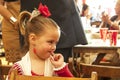 Girl dressed in red traditional costume