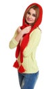 Girl dressed red woolen cap and scarf posing in studio on white background Royalty Free Stock Photo