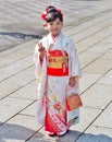Girl dressed in traditional dress called Kimono Royalty Free Stock Photo