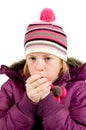 Girl dressed in winterclothes blowing Royalty Free Stock Photo