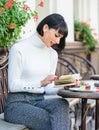 Girl drink coffee read book. Mug of good coffee and pleasant book best combination for perfect weekend. Woman have drink Royalty Free Stock Photo