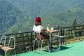 A girl drinking coffee in the morning in the mountains Royalty Free Stock Photo