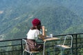 A girl drinking coffee in the morning in the mountains Royalty Free Stock Photo