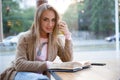 Girl drinking coffee and reading book Royalty Free Stock Photo