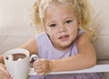 Girl Drinking Hot Chocolate out of Mug Royalty Free Stock Photo