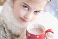 Girl drinking hot chocolate outdoor