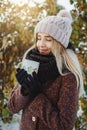 Girl drinking hot tea outdoors in winter Royalty Free Stock Photo