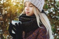 Girl drinking hot tea outdoors in winter Royalty Free Stock Photo