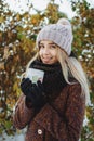 Girl drinking hot tea outdoors in winter Royalty Free Stock Photo