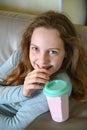 Girl drinking juice at home Royalty Free Stock Photo