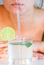 Girl drinking lime juice Royalty Free Stock Photo