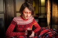 Girl drinking mulled wine on christmas and new years decorations in cafe Royalty Free Stock Photo