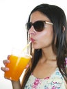 Girl drinking an orange frozen drink