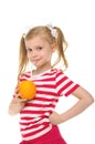 Girl drinking orange juice through straw Royalty Free Stock Photo
