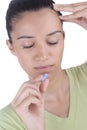 Girl taking pill Royalty Free Stock Photo