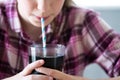 Close Up Of Girl Drinking Sugary Fizzy Soda From Glass With Straw